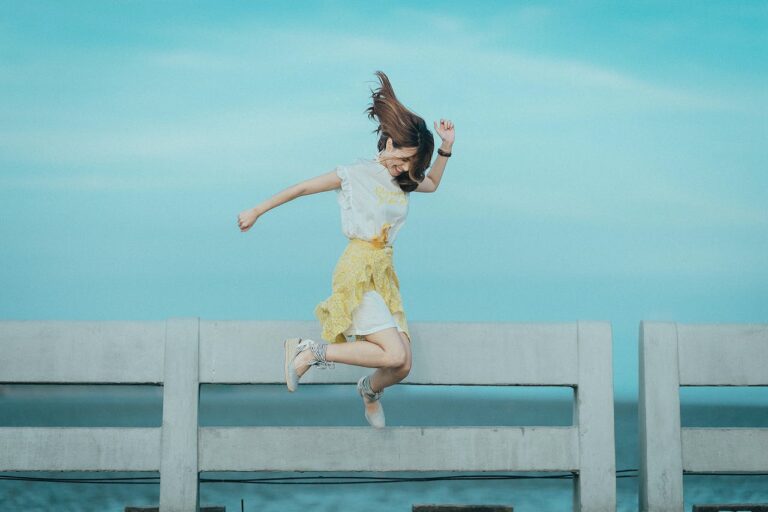 Jumping lady ocean view